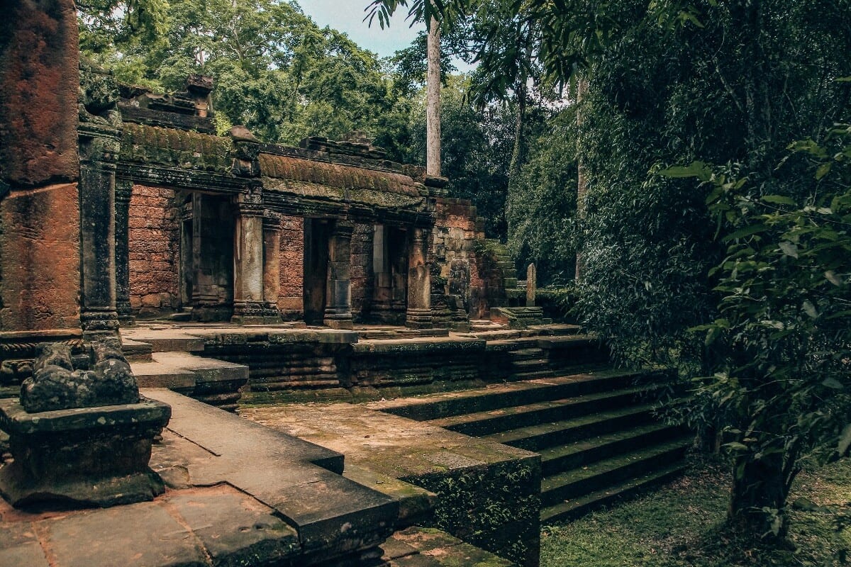 I'm Jess Traveling Siem Reap Colab Steps going into a temple at Angkor Wat Cambodia