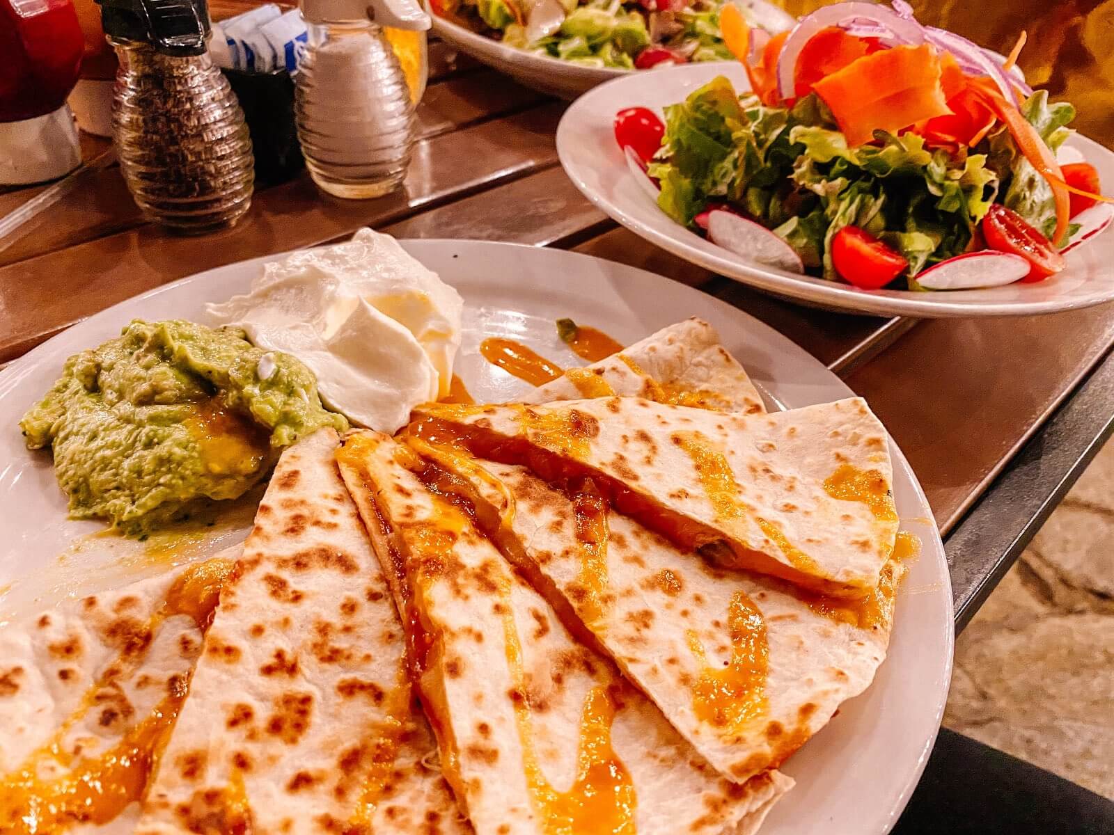Quesadilla and salad while eating in Hana, Maui Chicken quesadilla and salad at Hana Ranch restaurant in Hana HI