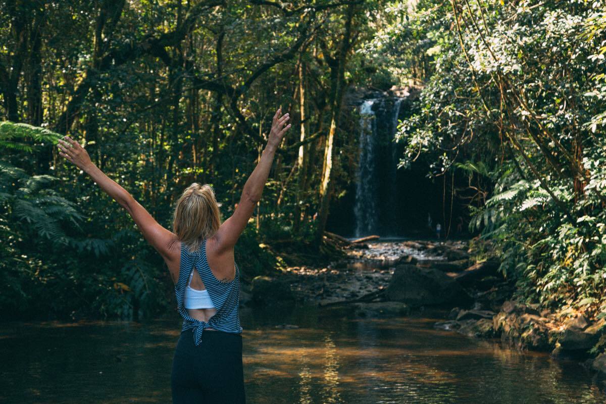 Twins Falls Girl in front of a waterfall in the distance