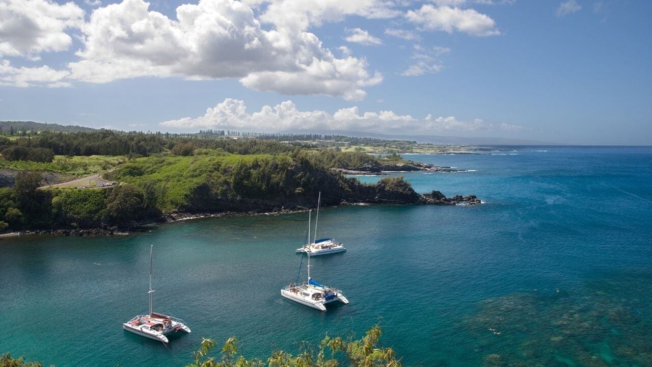Luxury sail at Honolua Bay Boats anchored at Honolua Bay on maui