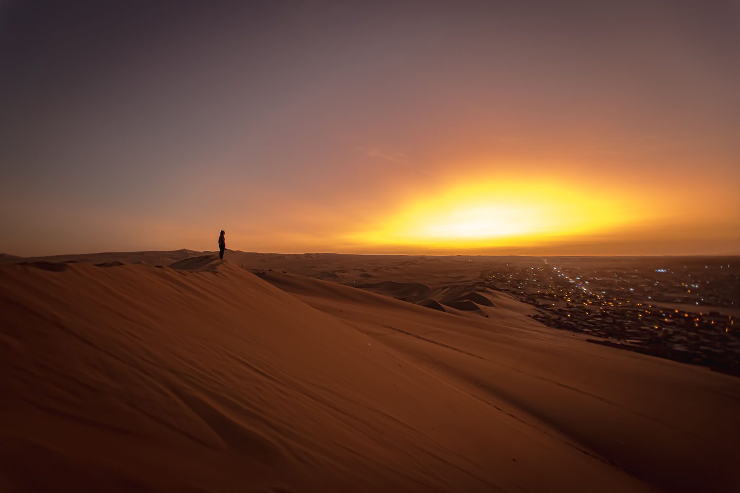 Sunset atop the dunes Huacachina, Peru Sunset atop the dunes